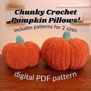 May include: Two crocheted pumpkin pillows in orange with teal stems. The pillows are made with a chunky yarn and have a textured surface. The text "Chunky Crochet Pumpkin Pillows! includes patterns for 2 sizes" and "digital PDF pattern" is visible in the image.