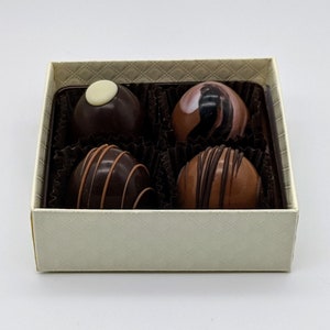 A box of handmade chocolate truffles, chocolate gift box, chocolate favors, assorted milk and dark chocolates, 4 pc