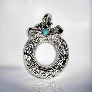 Dije/colgante vintage de corona de plata de Avon
