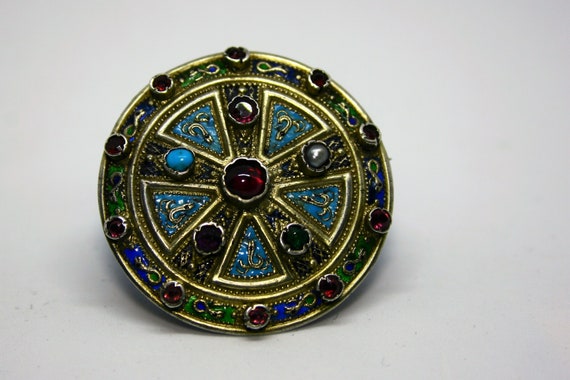 Silver brooch, enamel and gemstones