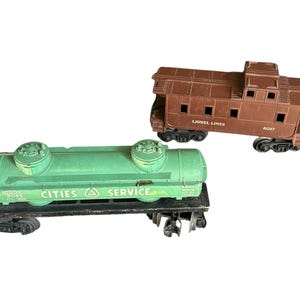 Trenes de calibre O de Lionel Lines, servicio de ciudades, tanque 6045, furgón de cola marrón 6017