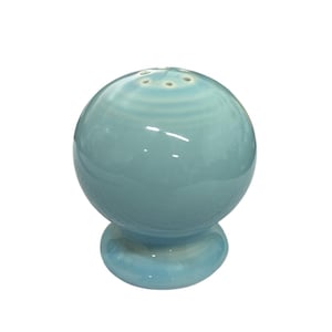 May include: A pale blue, spherical salt shaker with a glossy finish. The shaker has a rounded base and six small holes on top. The ceramic piece is a solid, pale blue colour.