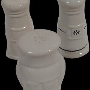 Longaberger pottery woven salt & pepper shakers (paprika color) with metal  caddy - Salt & Pepper Shakers, Facebook Marketplace