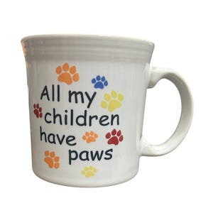 Fiesta - Taza blanca con asa "Todos mis hijos tienen patas" de Homer Laughlin