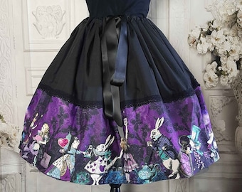 May include: A knee-length skirt featuring a solid black upper section with a black ribbon tie at the waist and a wide purple lower panel printed with Alice in Wonderland characters, including the White Rabbit and Mad Hatter, separated by black lace.