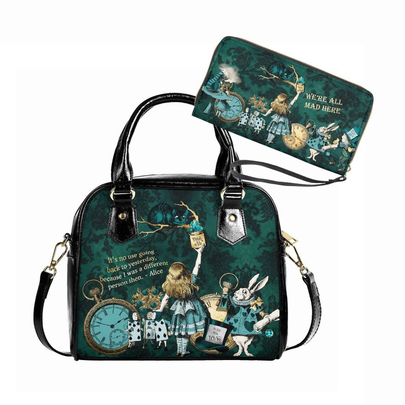 May include: A black and green handbag with a zippered wallet. The handbag features a print of Alice in Wonderland characters, including the Cheshire Cat, the Mad Hatter, and the White Rabbit. The text "It's no use going back to yesterday, because I was a different person then. - Alice" is printed on the handbag. The wallet features a print of Alice in Wonderland characters and the text "We're all mad here".