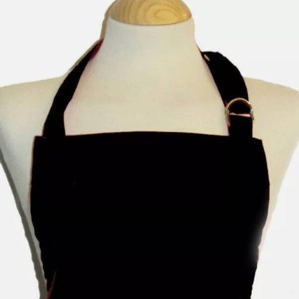 9 - 12 years black apron - 100% cotton. Metal d ring neck adjuster. made in England