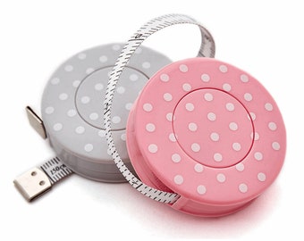 Retractable Tape Measure: Pink/grey polkadot/spot/dotty. Sewing and crafts. 150 cm long. Metric and imperial.