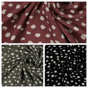 Random dots 100% Viscose Challis dress fabric by the half metre. Navy/green/black.