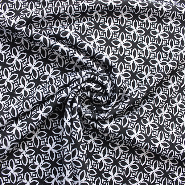 Tissu jersey extensible à carreaux de fleurs monochromes. Découpe sur commande par incréments de 0,5 m.