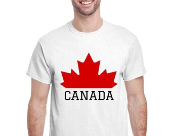 May include: White t-shirt with a red maple leaf and the word "CANADA" printed on the front.