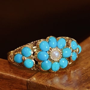 A Victorian 15ct Gold Ring Set With Turquoise And A Seed Pearl