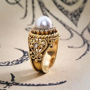 A classy Portuguese pearl and diamond dress ring.
