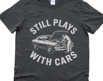 Still plays with cars, funny mechanic shirt