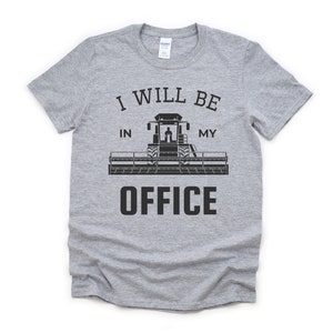 May include: Gray t-shirt with a black graphic of a combine harvester and the text "I will be in my office".
