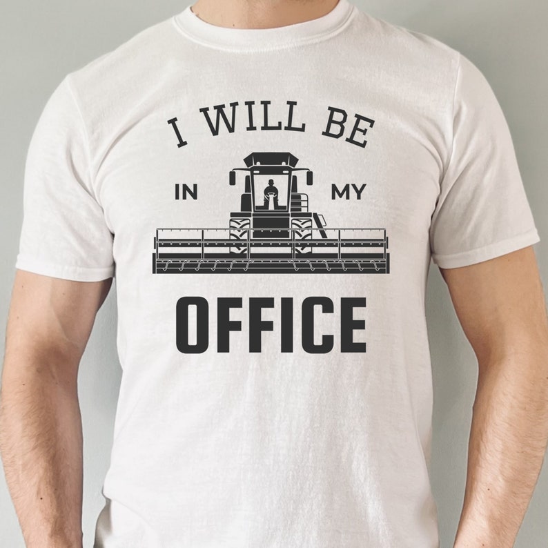 May include: White t-shirt with black text that reads "I will be in my office" with a black silhouette of a combine harvester in the middle of the text.