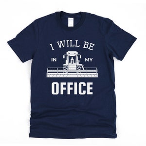May include: Navy blue t-shirt with a white graphic of a combine harvester and the text "I will be in my office".