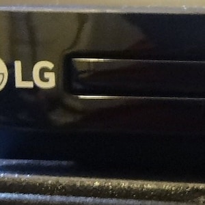 May include: A black LG DVD/CD player with the text "DVD/CD PLAYER" on the front.