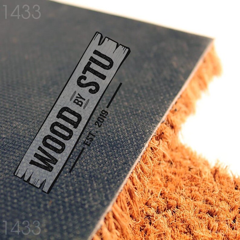 a logo for a company called "Wood by Stu" with a textured background and a wooden plank design.