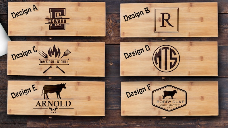 May include: Six different designs for personalized bamboo cutting boards. The designs include a monogram, a grill and chill design, a cow, and a monogram with a cow. The boards are made of natural bamboo and are perfect for grilling, serving, and entertaining.