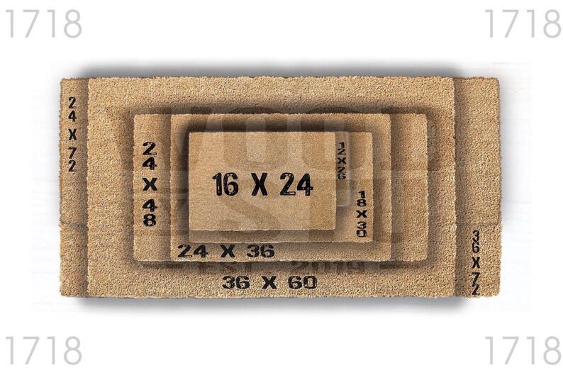 a close-up view of a textured, brown surface, possibly a mat or carpet, with a small text overlay indicating the size of the object in the image.