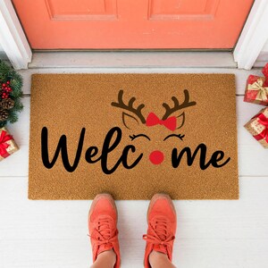 a pair of doormats with measurements for each of them
