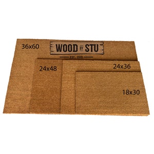 a pair of doormats with measurements for each of them