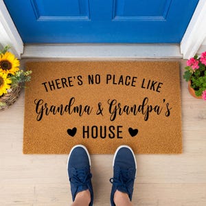 a pair of doormats with measurements for each of them
