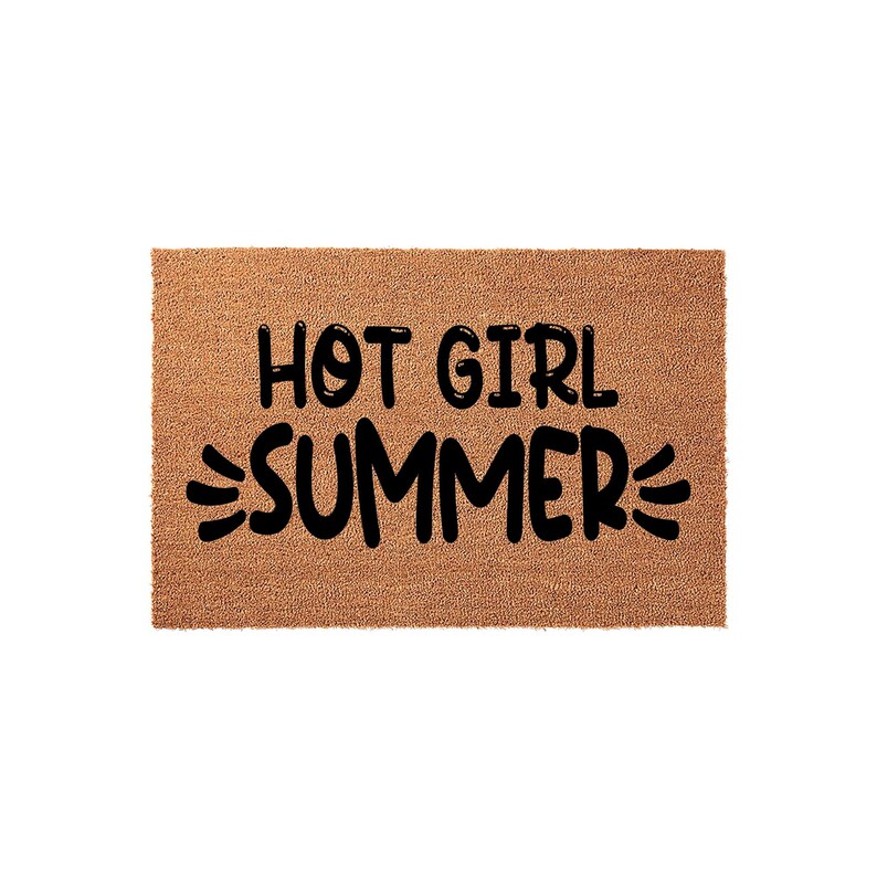 A textured area rug with the phrase "HOT GIRL SUMMER" printed on it.