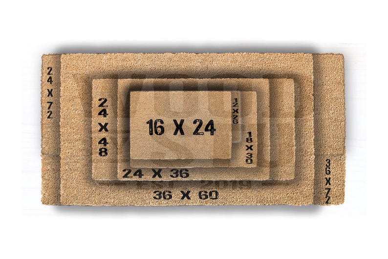 A mat with a design featuring a pair of reindeer and the text "Welcome to our home" printed on it.
