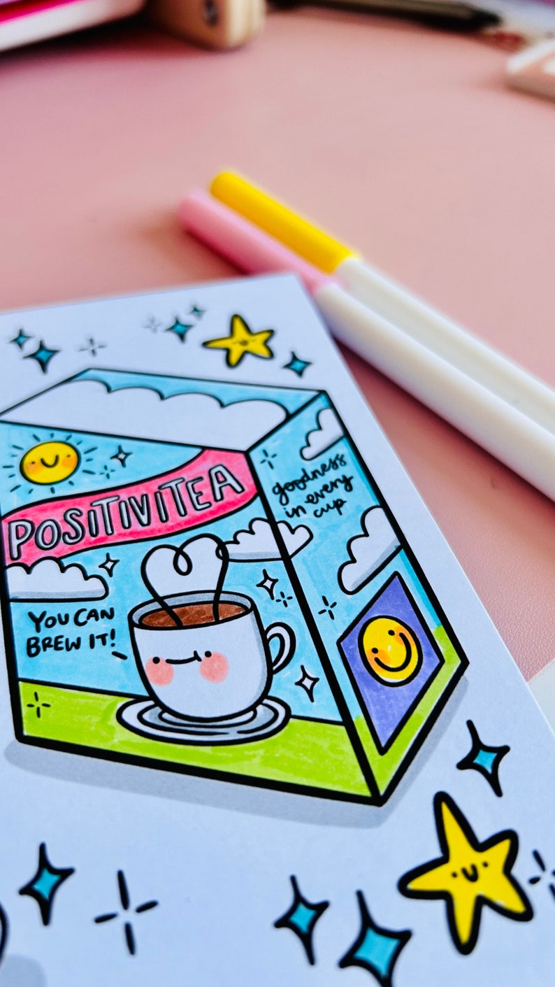 May include: A hand-drawn illustration of a box of tea labelled "Positivitea" with a cup of tea and the text "You can brew it!" and "goodness in every cup". The illustration is surrounded by stars and a sun.