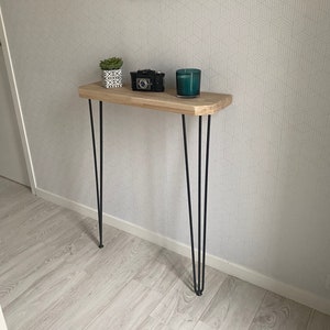 Oak console table with beveled corners in an industrial style