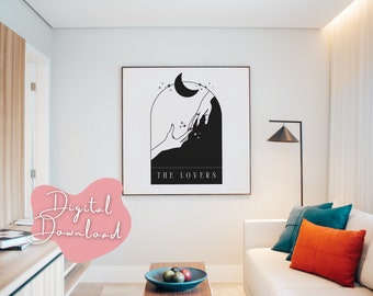 May include: Black and white illustration of two hands reaching towards each other under a crescent moon with stars. The text "THE LOVERS" is below the image.