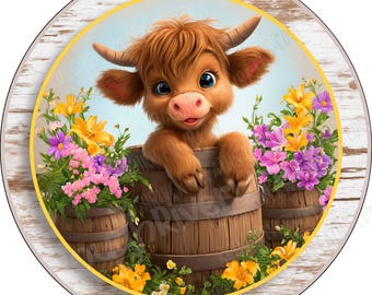 May include: A circular decorative sign featuring a fluffy brown Highland calf peeking out from a wooden barrel. The calf is surrounded by clusters of vibrant yellow, pink, and purple flowers in smaller wooden barrels against a light blue background.