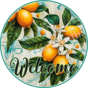 May include: A round welcome sign with a green, white, and yellow floral design featuring lemons and blossoms. The word "Welcome" is written in black cursive lettering.