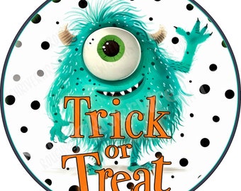 May include: A circular sign featuring a fuzzy teal monster with one large green eye, two small horns, and a wide smile. The monster is waving one hand. The background is white with black polka dots. The orange text reads Trick or Treat.