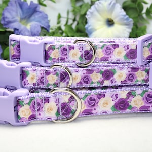 May include: Three purple and white floral dog collars with silver metal D-rings and plastic buckles.