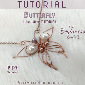 May include: A copper-coloured wire-wrapped butterfly pendant necklace with pearl accents. The image includes text that reads "Tutorial Butterfly Wire Wrap Tutorial For Beginners Level-2 PDF Tutorial Artsville Handcrafted."