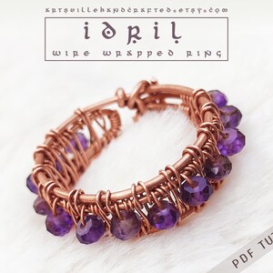 May include: A copper wire wrapped ring with amethyst gemstones. The ring is made using a wire wrapping technique and features a cluster of purple amethyst stones. The ring is a handmade piece of jewellery.