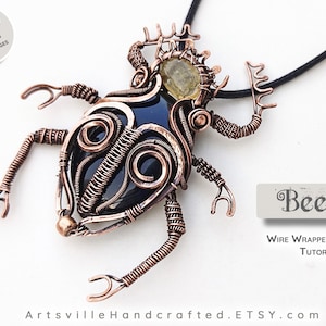 May include: A copper wire wrapped beetle pendant with a black gemstone and a yellow gemstone. The pendant is on a black cord and is labeled "Beetle Wire Wrapped Pendant Tutorial".