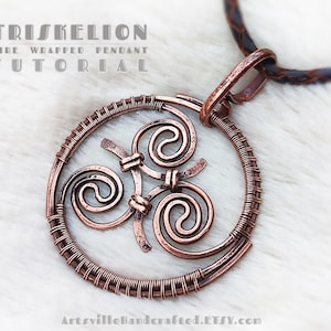 May include: A copper wire wrapped pendant in the shape of a triskelion, a Celtic symbol of three spirals. The pendant is on a brown leather cord.