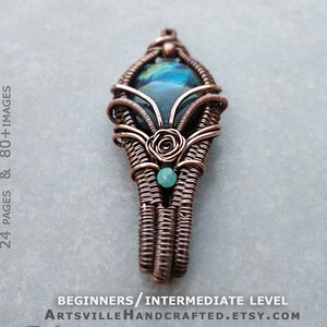 May include: A copper wire wrapped pendant featuring a large iridescent blue-green gemstone and a smaller green gemstone. The pendant is in the shape of a teardrop with a rose-like design at the top.