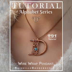 May include: Copper wire-wrapped pendant necklace featuring the letter "D" with a turquoise and copper bead accent. The necklace is part of the "Alphabet Series" and is a PDF tutorial. The pendant hangs on a delicate chain.