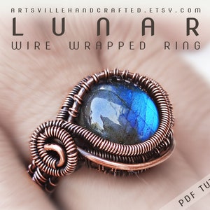 May include: A copper wire wrapped ring with a blue and gray labradorite gemstone. The ring is handmade and has a unique design. The text "LUNAR WIRE WRAPPED RING" is visible at the top of the image. The text "PDF TUTORIAL" is visible at the bottom of the image.