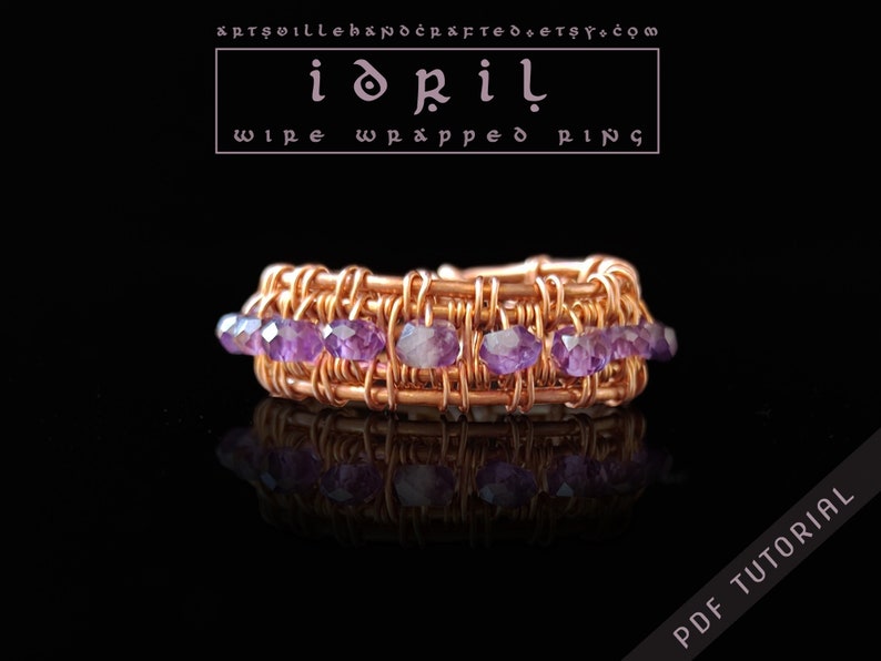 May include: A copper wire wrapped ring with a row of amethyst gemstones. The ring is on a black background and the text "idril wire wrapped ring" is above the ring.