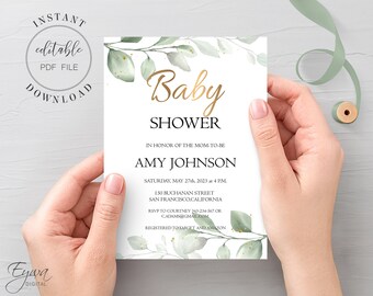 May include: A white baby shower invitation with green and gold foliage. The text reads "Baby Shower" in gold lettering, "In honour of the mom-to-be Amy Johnson", "Saturday, May 27th, 2023 at 4 PM", "150 Buchanan Street, San Francisco, California", "RSVP to Courtney 343-234-567 or cadams@gmail.com", and "Registered to Target and Amazon".