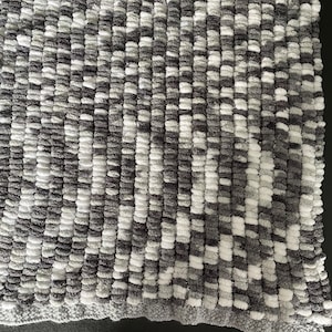 Soft snuggly baby pompom blanket
