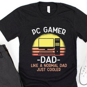 May include: Black t-shirt with a retro sunset graphic and the text "PC Gamer -Dad- Like a normal dad just cooler".