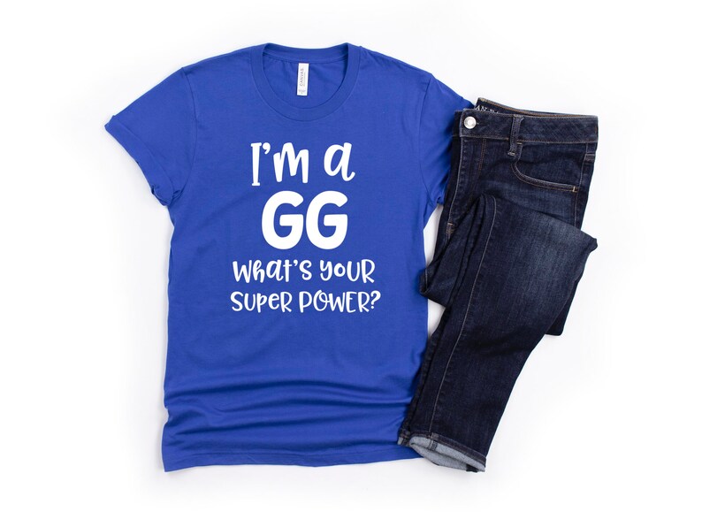 May include: A royal blue t-shirt with white text that reads "I'm a GG What's your super power?"