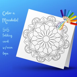 May include: A black and white mandala design on a white card with the text "Color a Mandala! 5x5 folding card w/envelope" printed on the left side. A set of colored pencils are laying on the card.